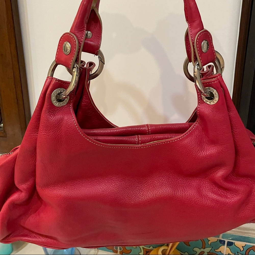 Red leather bag w/chrome/silver. Great condition. By “Prune”